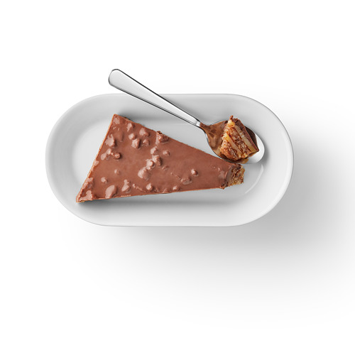 Chocolate-covered almond toffee on plate with spoon