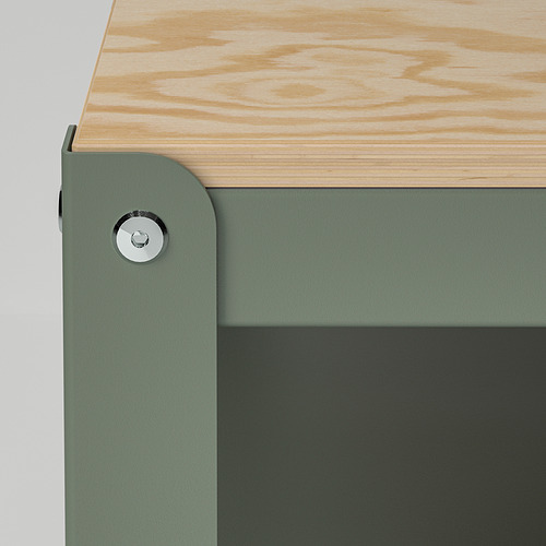 A sturdy storage trolley with a green metal base and wooden top, featuring a locking wheel for stability.