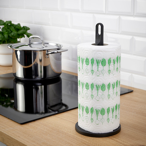 Soporte de rollo en el mostrador, diseñado con un lazo de transporte, sostiene un rollo de papel estampado.
