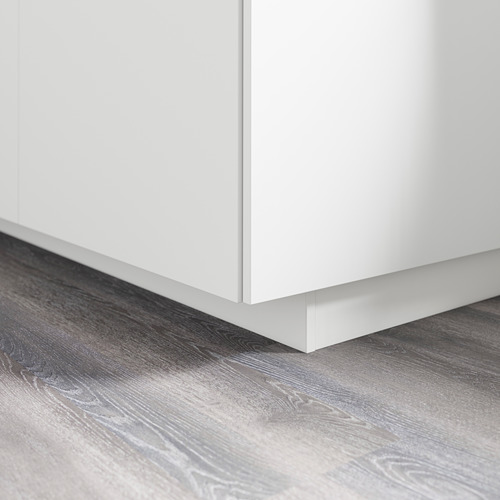 White cabinet base with plinth covering floor gap, part of ikeas metod series.