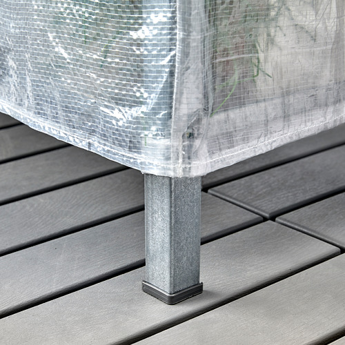 Una unidad de almacenamiento en una cubierta con una cubierta transparente, diseñada para proteger los artículos del polvo y crear un pequeño invernadero.