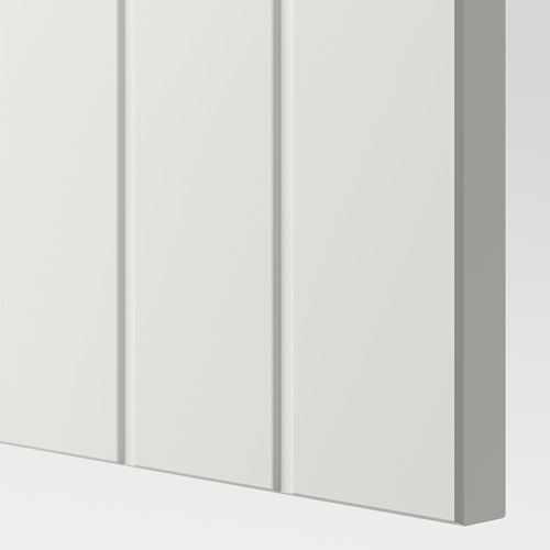 Sleek white storage unit with glass doors, showcasing organized items. Quality craftsmanship evident in smooth edges and sturdy design.