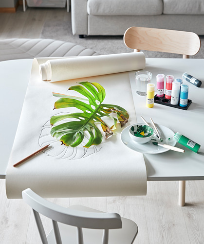 Mesa de arte con papel de dibujo, pinturas, pinceles y hojas MÅLA.