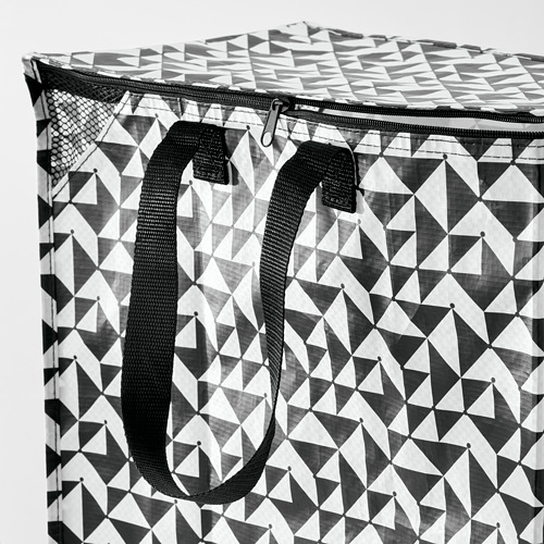 Bolsa de compras reutilizable con motivos geométricos en blanco y negro con asas negras resistentes y parte superior con cremallera, lo que indica durabilidad y practicidad.