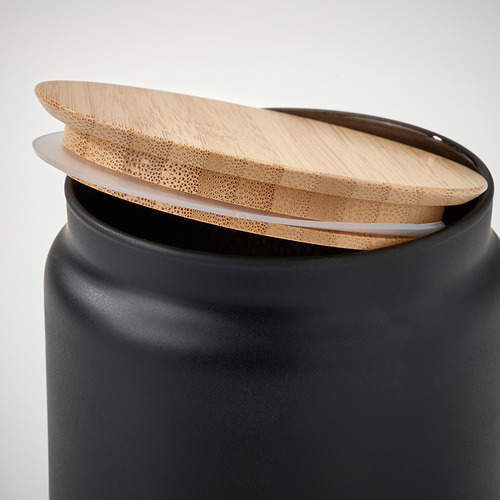 Tarro negro con tapa de bambú, ideal para alimentos secos.