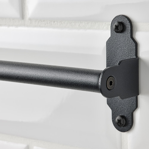 Primer plano de un robusto soporte de raíl de metal negro, fijado de forma segura con tornillos, que forma parte de la serie HULTARP.