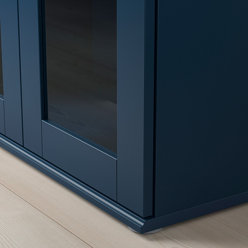 Armario SKRUVBY azul oscuro con puerta de cristal; Líneas limpias, construcción robusta.