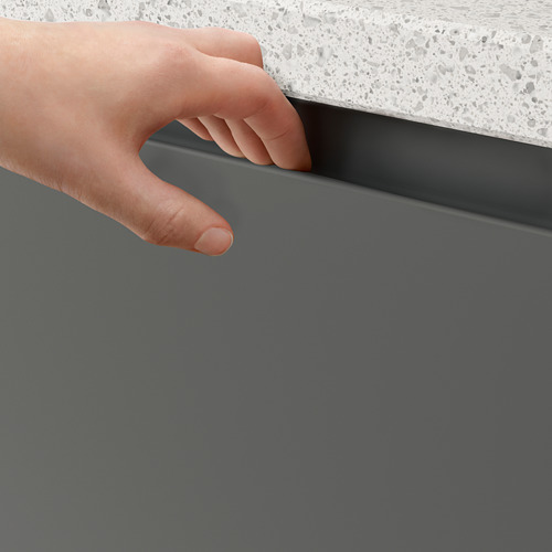 Persons hand opening dark grey cabinet with integrated handle.
