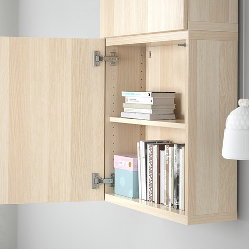 Bookshelf with open door, showing adjustable shelves and soft-close hinges.