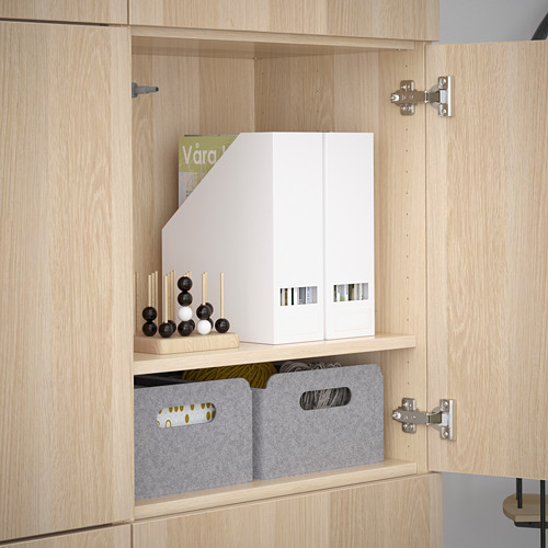 Wooden cabinet with adjustable shelves, grey bins, and a white organizer. Soft-close hinges visible.
