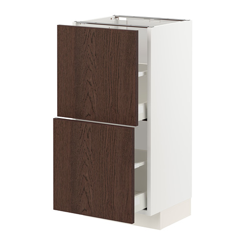 Dark brown wooden drawers on white cabinet.