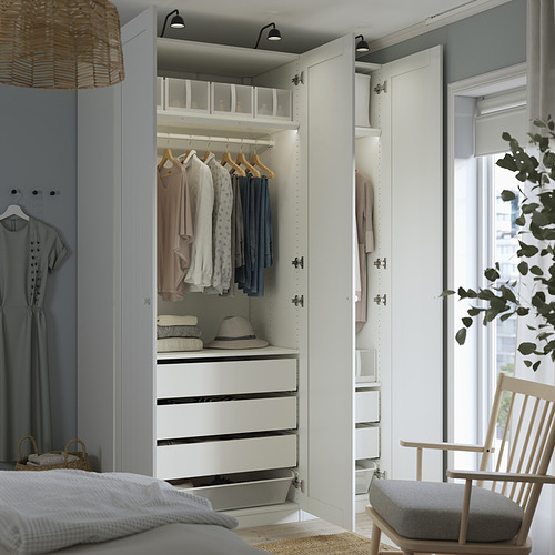 Modern bedroom wardrobe with open section showing clothes, drawers, and storage.