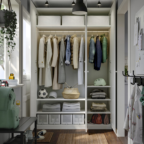 Organized closet showing clothes, accessories, and storage shelves.
