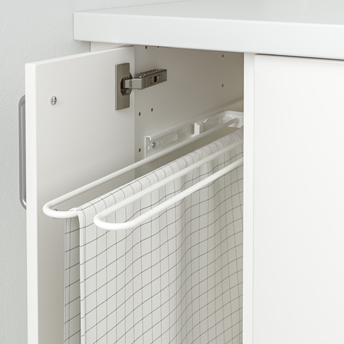 Un toallero blanco de UTRUSTA con una toalla con estampado de rejilla parcialmente extraída. Es un mecanismo de deslizamiento suave para un fácil acceso.