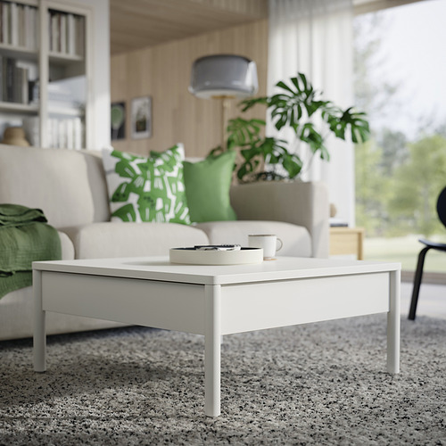 Mesa de centro moderna de color blanco roto con cajones. Diseño minimalista y limpio.