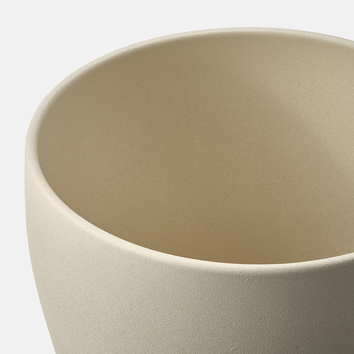 Jardinera cilíndrica de color beige, acabado mate liso. Loza de alta calidad con un recubrimiento pigmentado uniforme.