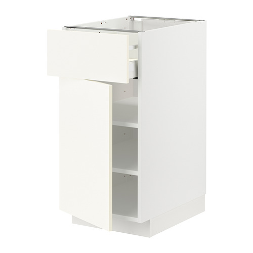 A white METOD kitchen cabinet with one door open, revealing an empty interior and adjustable shelves.