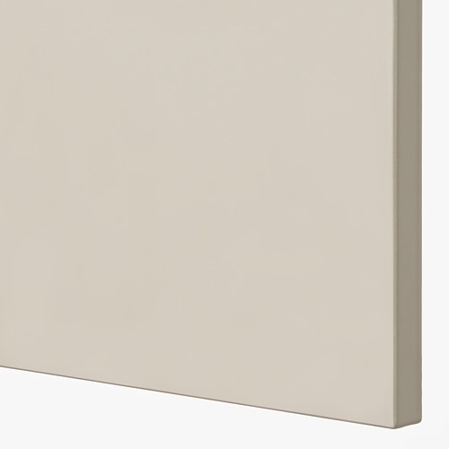 Primer plano de la puerta lisa del armario de color beige, que muestra un acabado limpio y de alta calidad.