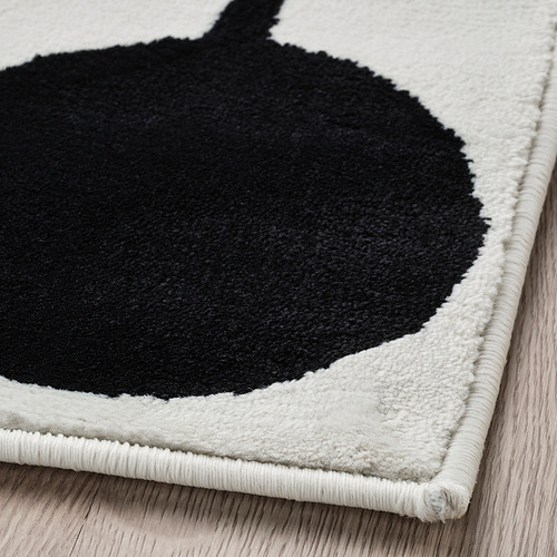 Alfombra moderna en blanco y negro con pelo suave y bajo para mayor comodidad. Bordes cuidadosamente encuadernados para mayor durabilidad.