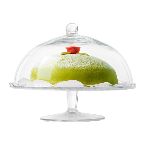 El soporte para pasteles de vidrio transparente con tapa de cúpula muestra el pastel verde, mantiene el contenido fresco y protegido.