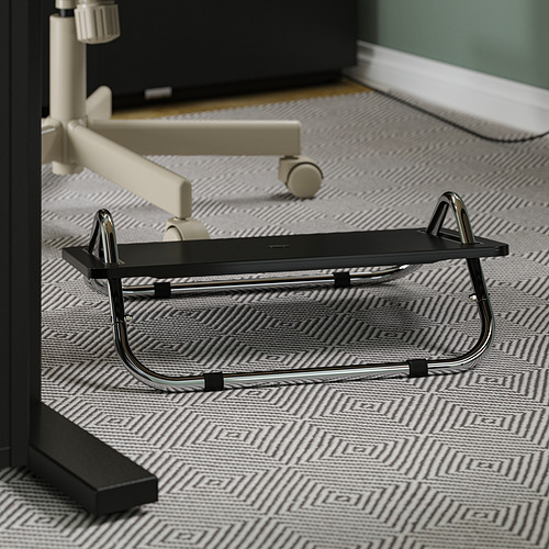 DAGOTTO black footrest on floor, chrome legs, abs plastic plate, non-slip surface.