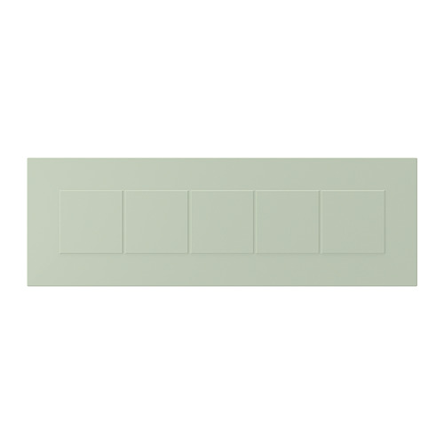 Un panel rectangular verde con divisores ranurados, que representa un frente STENSUND hecho de tableros de fibra y pintura.
