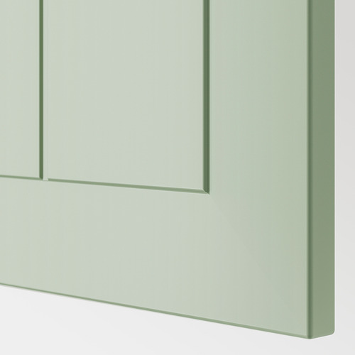 Puerta de armario de color verde claro con acabado liso y líneas limpias.
