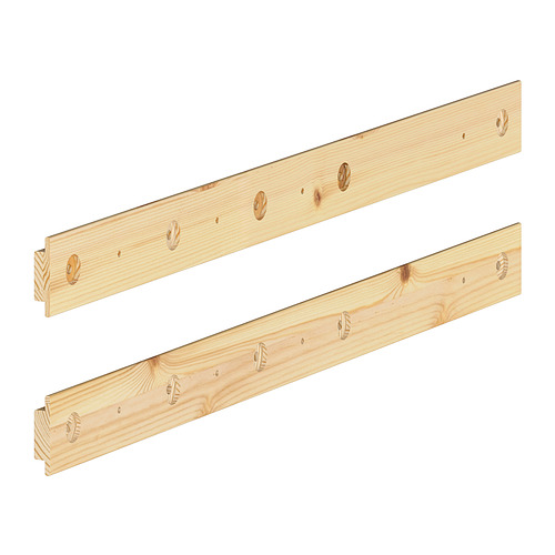Two light-colored wooden planks, one plain, one with grooves, displayed diagonally.