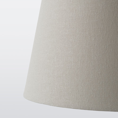 Pantalla cilíndrica, textura de tela suave, color beige, diseño clásico.