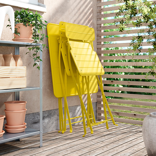 Sillas SUNDSÖ de color amarillo brillante, apilables, plegadas, de diseño moderno. Perfecto para balcones, espacios pequeños. Acero con recubrimiento en polvo, premontado.