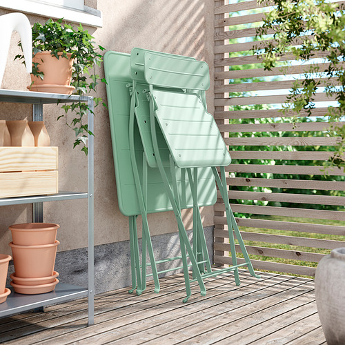 Mesa de exterior verde plegable, ideal para espacios pequeños, fácil de almacenar, fabricada en acero duradero con recubrimiento en polvo.