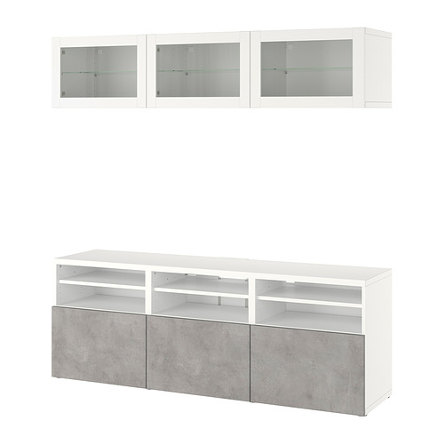 Moderno mueble de tv blanco con cajones efecto cemento y armarios con puerta de cristal.