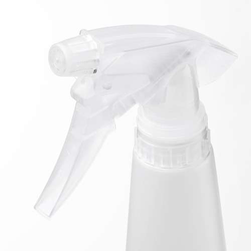 Boquilla de botella rociadora transparente con configuraciones de rociado ajustables, montada en un contenedor blanco.
