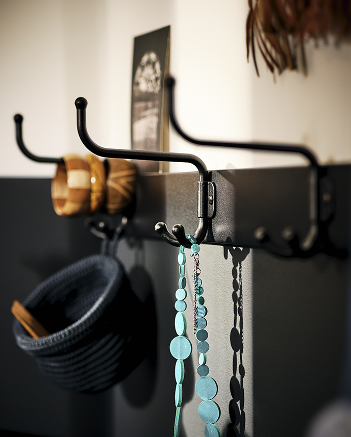 PINNIG rack creating a practical spot to hang accessories, keeping the entryway organized with a modern touch.