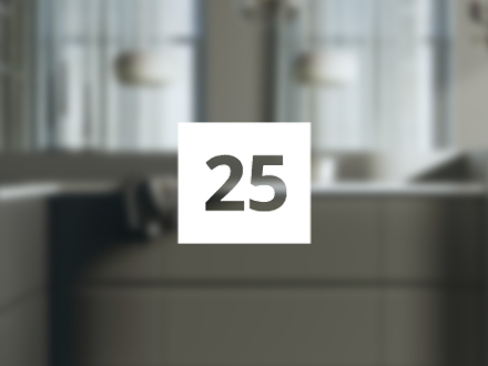 Number 25 transparent, in a white frame in the background a modern kitchen completely out of focus.