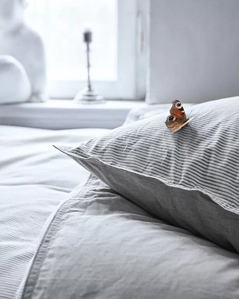 Pillow on a bed in a bedroom.