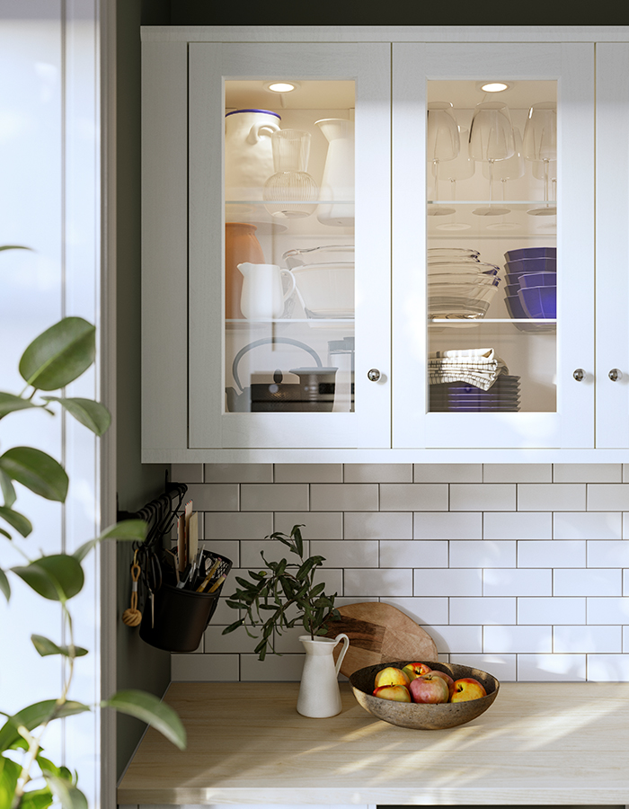 Kitchen cabinet with ENKÖPING glass door, ENERYDA handles, and a HULTARP rail with container.