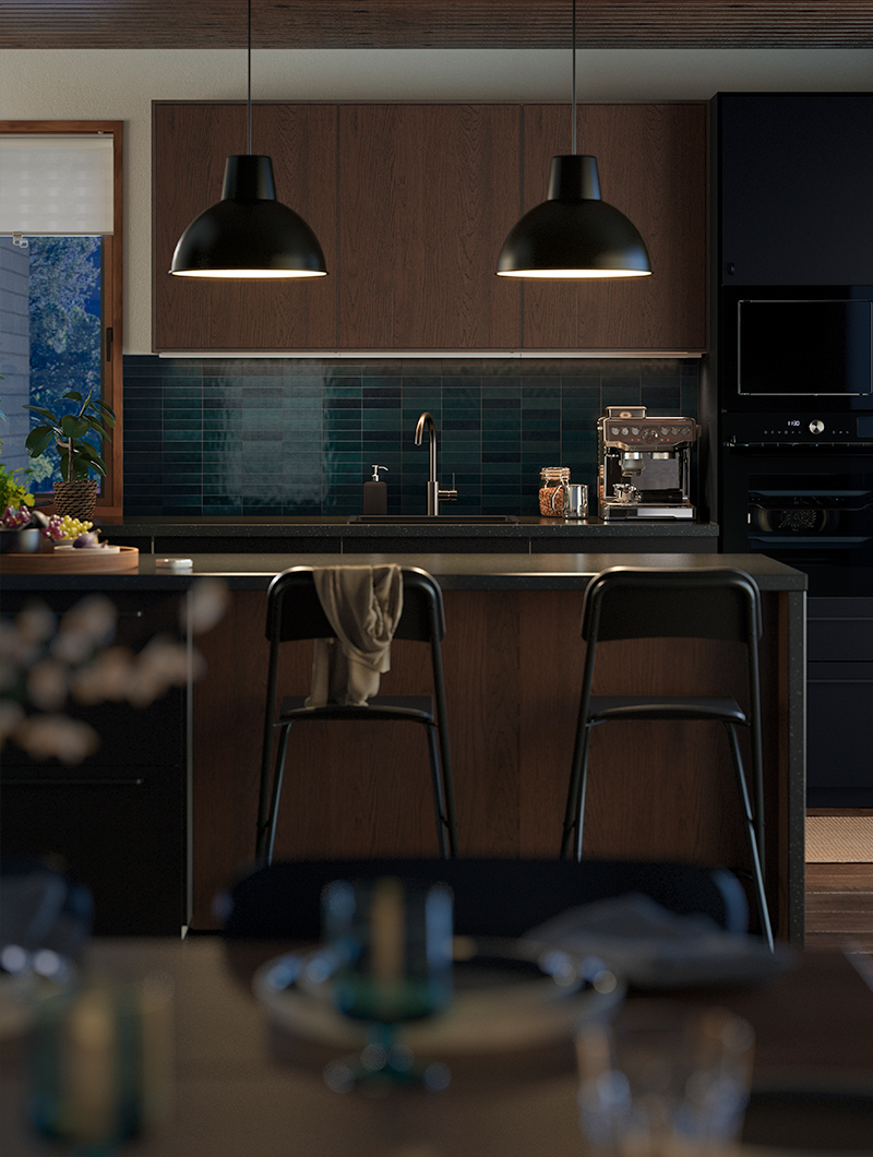 Modern kitchen with dark wood cabinets, turquoise tiles, and two black pendant lamps. An elegant and warm ambiance.