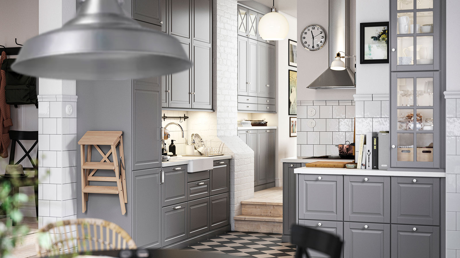 Dark gray kitchen with METOD wall cabinet, MATTRADITION extractor hood, and JÄRPLIDEN pendant lamp.