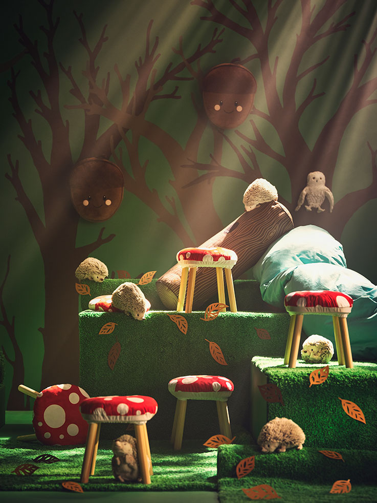 Fantasy forest with mushroom stools, hedgehogs, and plush objects. Magical and playful atmosphere.