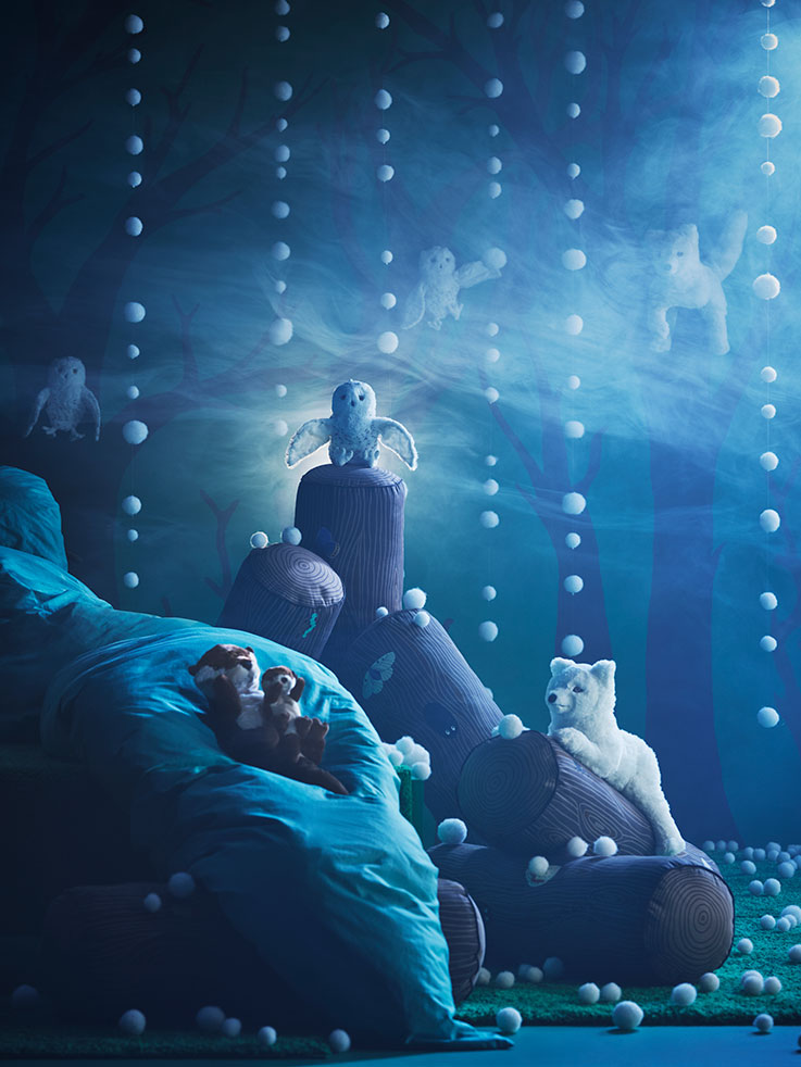Plush otters and a white owl in a mysterious blue forest with glowing orbs. Magical atmosphere.