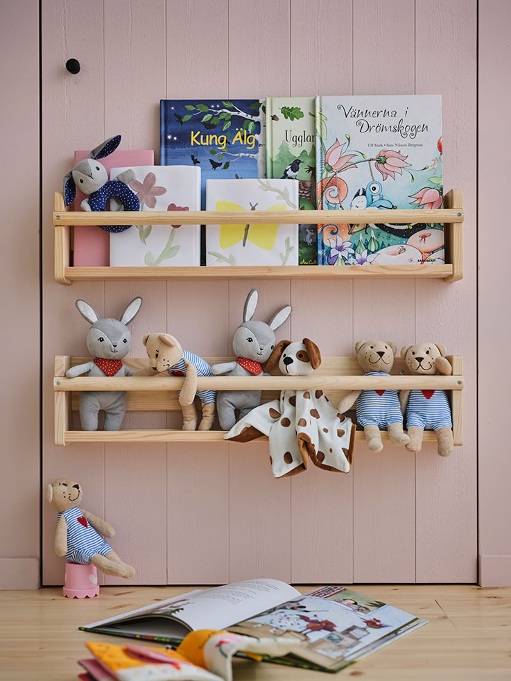 Two pine-style hanging shelves, both filled with stuffed toys and children's storybooks.