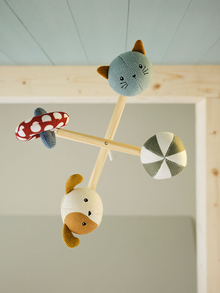  a baby crib mobile hanging from the ceiling