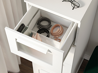 Chest of drawers with various items inside