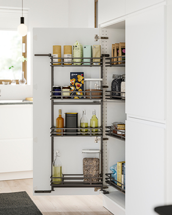 Tall kitchen pantry with dark metal pull-out shelves and baskets, organized with jars, spices, and food items. Maximum capacity and easy access in your kitchen.