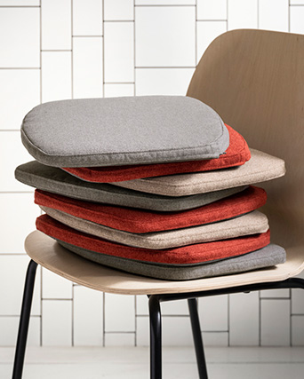 a chair with lots of cushions on it