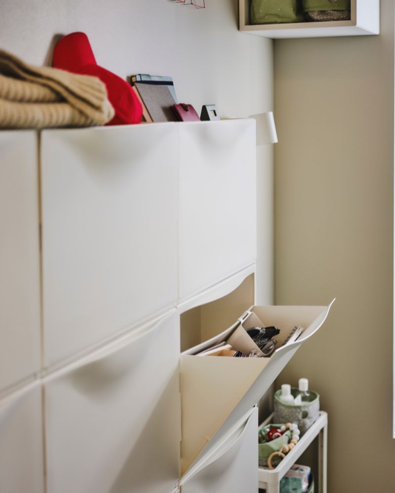 TRONES shoe cabinet provides easy-access storage, paired with LEN boxes, a VESKEN cart, an EKET wall shelf and the NYMÅNE lamp.