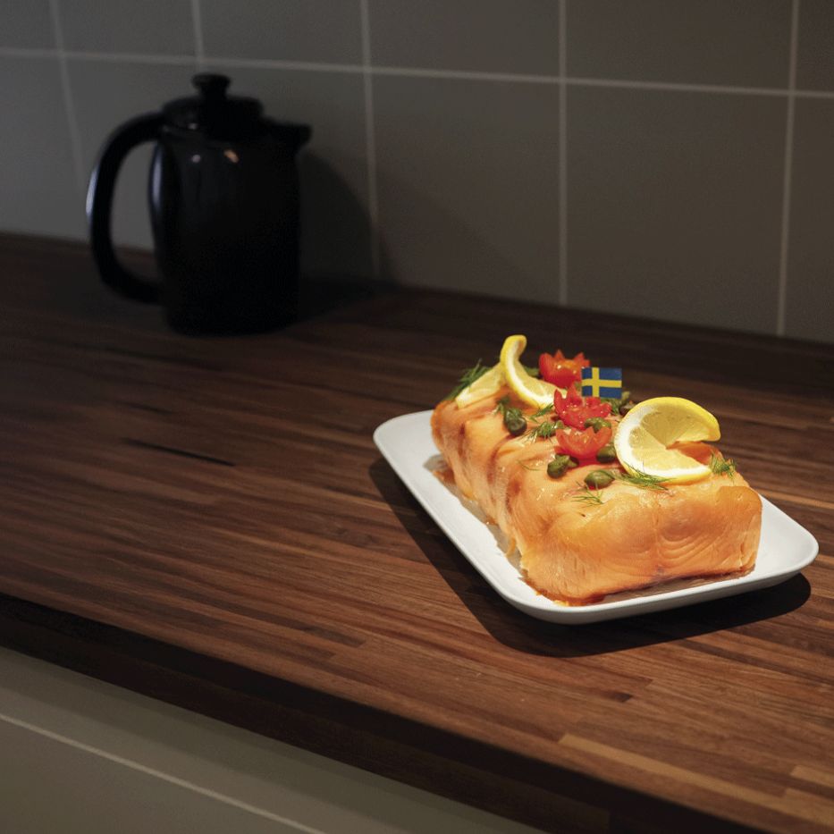 Smörgåstårta, a savory Swedish sandwich cake made with layers of bread and creamy fillings