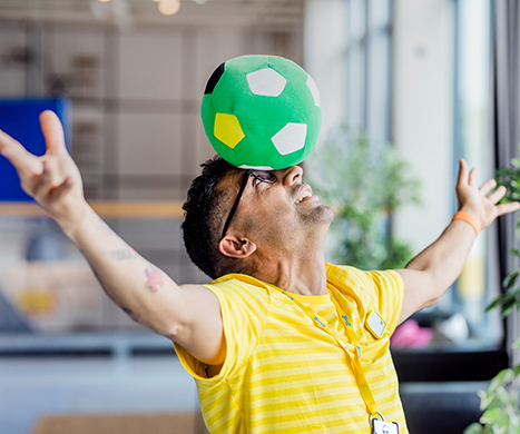 An IKEA employee with open arms