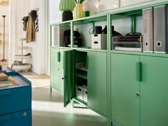 Organized office storage with TROTTEN cabinet, IKEA PS 2026 lighting, MÄSTERROT curtains and DRÖNJÖNS organizers.